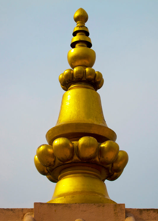A large golden object on top of a building