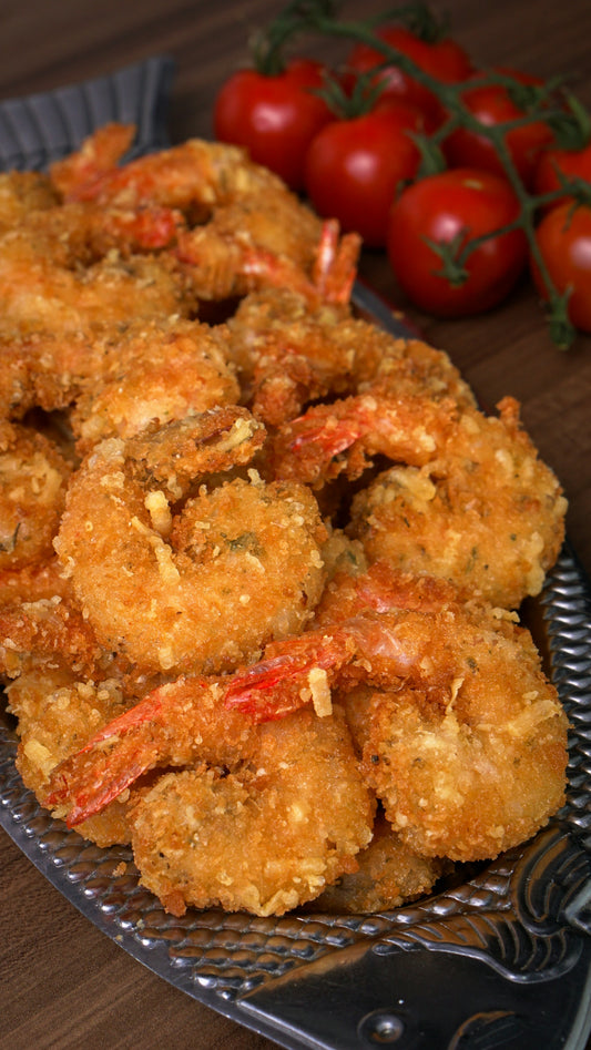 Crispy fried shrimp are arranged on a platter.