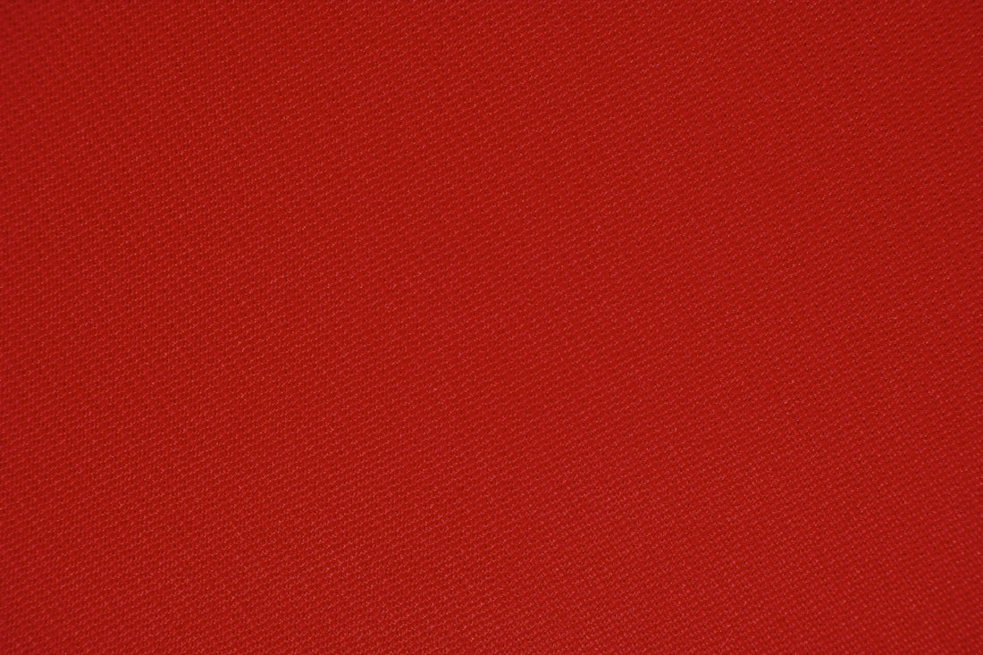 red textile in close up photography
