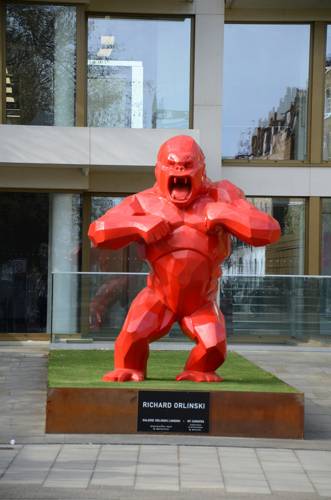 a statue of a man in a red suit