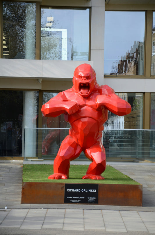 a statue of a man in a red suit